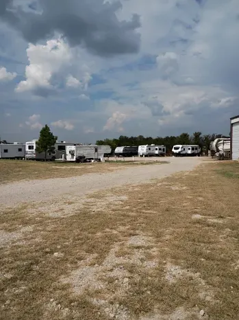 RVs and trailers parked on open spaces at Quiet Stay RV Park in Morrison, Oklahoma